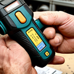 **

A close-up shot of a man's hands carefully inspecting a power drill. He's holding a receipt and warranty card. The background is slightly blurred, suggesting a hardware store or workshop. The overall tone is one of attentiveness and responsibility. Focus on the details: the texture of the tool, the clarity of the paperwork, and the man's expression. Include some tools in the background

**